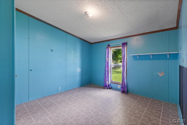 943 Howell Ave, Adrian, MI 49221 - empty room with a textured ceiling and crown molding