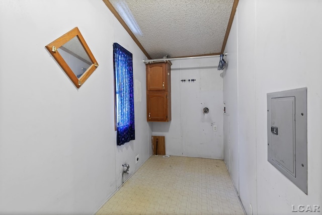 943 Howell Ave, Adrian, MI 49221 - corridor with light floors, electric panel, and a textured ceiling