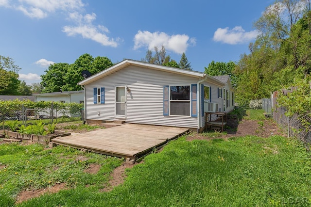 943 Howell Ave, Adrian, MI 49221 - rear view of property featuring a wooden deck and cooling unit