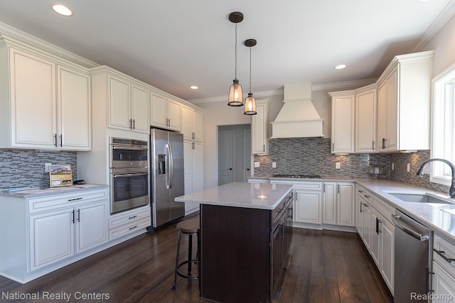 7118 Oak Ridge Ct, Clarkston, MI 48348 - kitchen featuring a sink, appliances with stainless steel finishes, custom range hood, dark wood-style floors, and crown molding