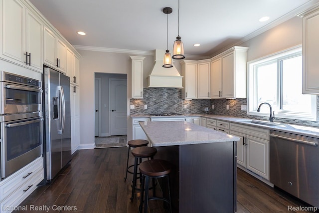 7118 Oak Ridge Ct, Clarkston, MI 48348 - kitchen with stainless steel appliances, a sink, custom range hood, tasteful backsplash, and dark wood-type flooring
