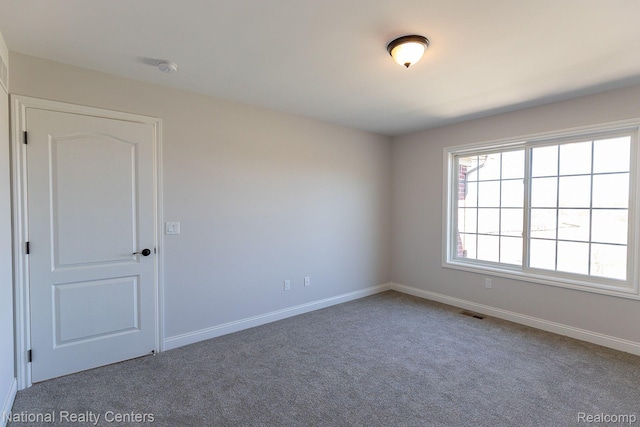 7118 Oak Ridge Ct, Clarkston, MI 48348 - unfurnished room featuring carpet floors and baseboards