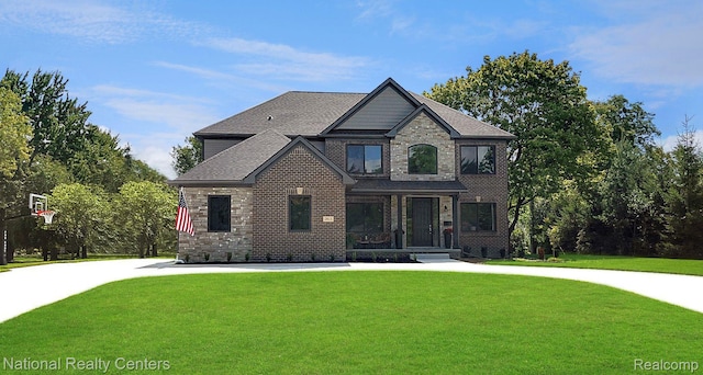 7118 Oak Ridge Ct, Clarkston, MI 48348 - view of front of home featuring a front yard and stone siding