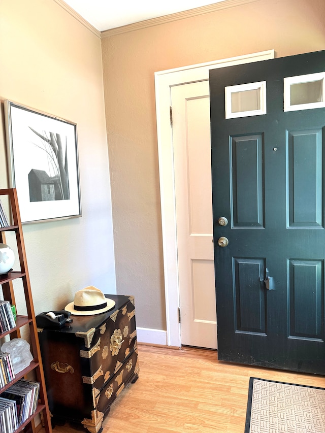 25220 Code Rd, Southfield, MI 48033 - entrance foyer featuring light wood-style floors, crown molding, and baseboards