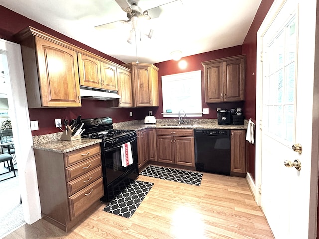 25220 Code Rd, Southfield, MI 48033 - kitchen with black appliances, under cabinet range hood, a sink, light wood-type flooring, and a ceiling fan