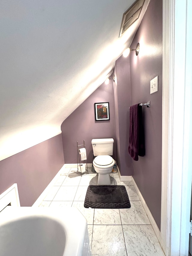 25220 Code Rd, Southfield, MI 48033 - bathroom with vaulted ceiling, marble finish flooring, toilet, and baseboards