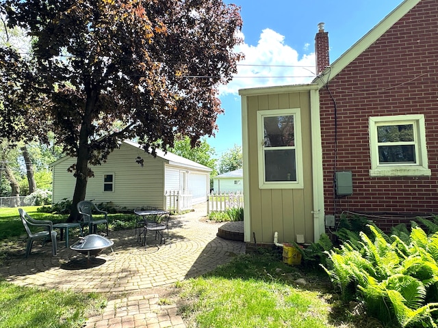 25220 Code Rd, Southfield, MI 48033 - view of patio / terrace featuring an outbuilding and a detached garage