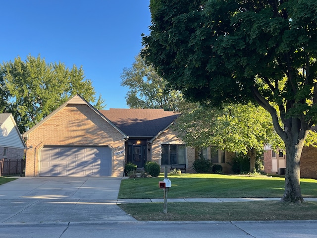 39858 Wilmette Dr, Sterling Heights, MI 48313 - view of front of property with brick siding, a garage, and concrete driveway