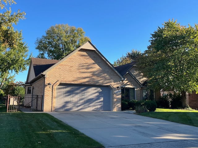 39858 Wilmette Dr, Sterling Heights, MI 48313 - view of front of property featuring brick siding, an attached garage, concrete driveway, and a front lawn
