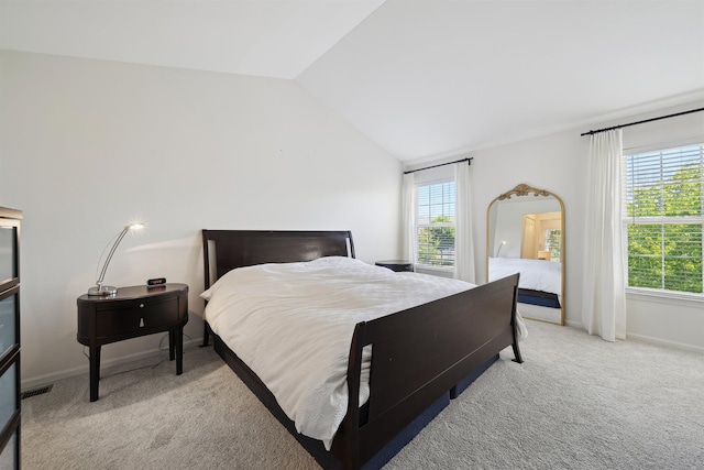 5639 Heathland Cir, Clarkston, MI 48346 - bedroom featuring multiple windows, light colored carpet, lofted ceiling, and baseboards