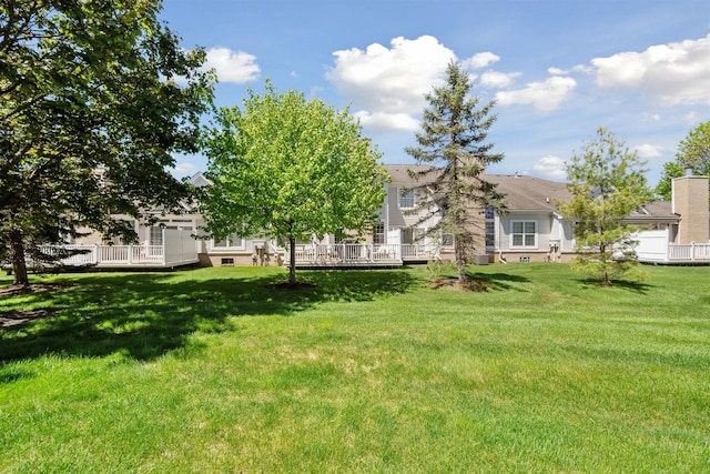 5639 Heathland Cir, Clarkston, MI 48346 - view of green lawn with a wooden deck