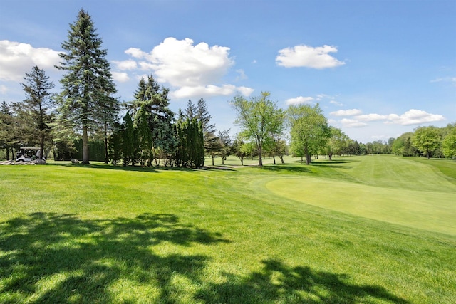 5639 Heathland Cir, Clarkston, MI 48346 - view of home's community with a lawn, view of golf course, and view of wooded area