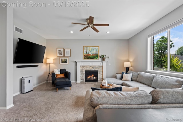 52851 Schafers Run Ct, Chesterfield, MI 48051 - living room with light colored carpet, ceiling fan, a stone fireplace, and recessed lighting