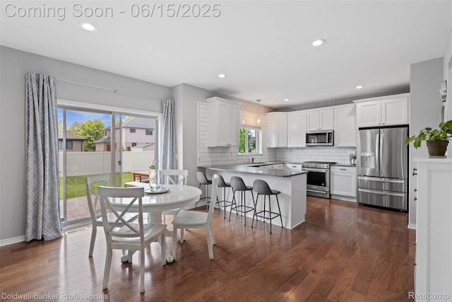 52851 Schafers Run Ct, Chesterfield, MI 48051 - dining space with dark wood finished floors and recessed lighting