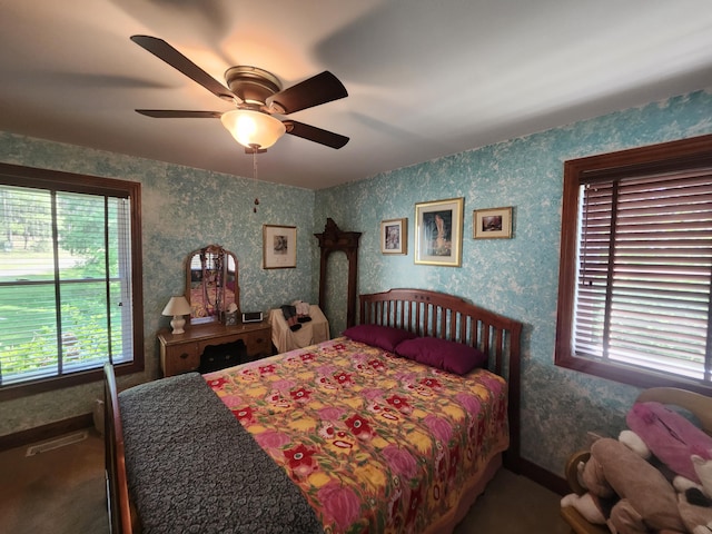 5005 S Brye Rd, Ludington, MI 49431 - bedroom featuring wallpapered walls and ceiling fan