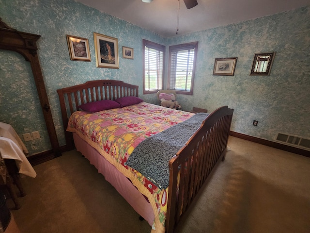5005 S Brye Rd, Ludington, MI 49431 - carpeted bedroom featuring wallpapered walls, baseboards, and ceiling fan