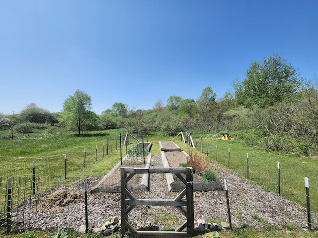 5005 S Brye Rd, Ludington, MI 49431 - view of yard with a garden, fence, and a view of rural / pastoral area