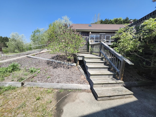 5005 S Brye Rd, Ludington, MI 49431 - view of front of property featuring a garden and stairs