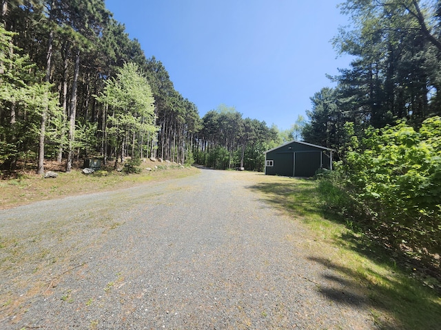 5005 S Brye Rd, Ludington, MI 49431 - view of road with a pole building and a view of trees