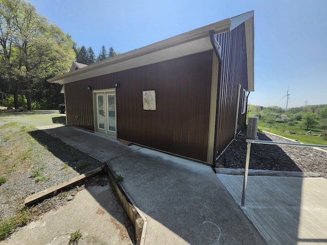 5005 S Brye Rd, Ludington, MI 49431 - rear view of property featuring french doors and central AC