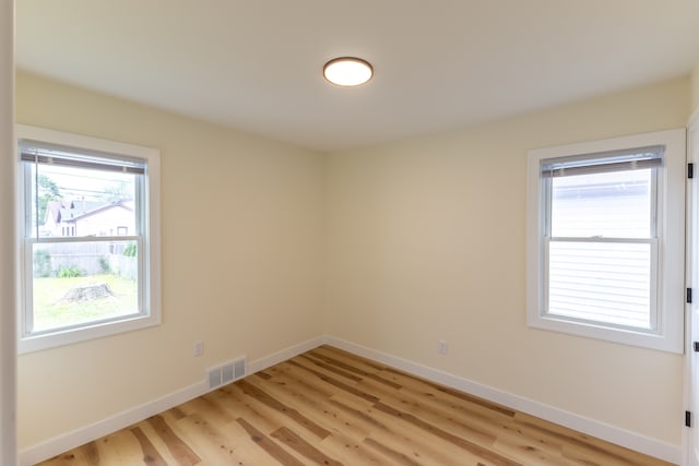 27396 Beechurst St, Roseville, MI 48066 - empty room with healthy amount of natural light, baseboards, and light wood-style floors