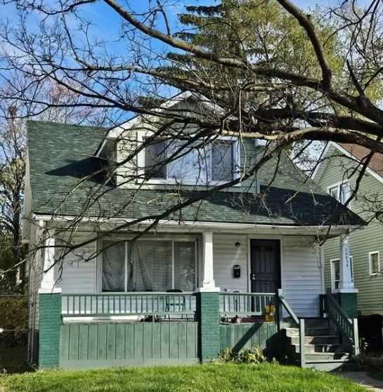 14536 Washburn St, Detroit, MI 48238 - view of front of house featuring a porch and roof with shingles