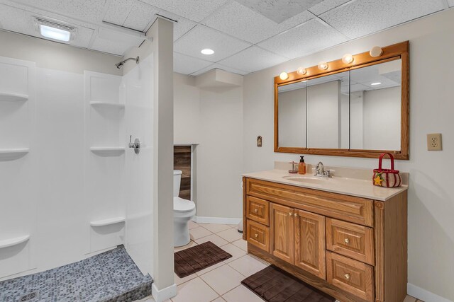 8595 Rives Junction Rd, Rives Junction, MI 49277 - full bath featuring toilet, a shower, tile patterned floors, vanity, and baseboards