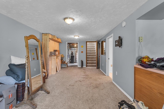 8595 Rives Junction Rd, Rives Junction, MI 49277 - finished below grade area with stairway, carpet, a textured ceiling, and baseboards