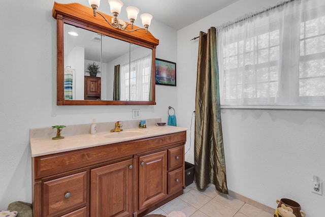 8595 Rives Junction Rd, Rives Junction, MI 49277 - bathroom with tile patterned floors, vanity, and baseboards