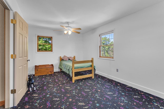 8595 Rives Junction Rd, Rives Junction, MI 49277 - bedroom featuring carpet flooring, multiple windows, and baseboards