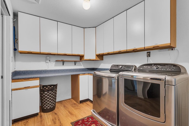 8595 Rives Junction Rd, Rives Junction, MI 49277 - laundry room with light wood finished floors, cabinet space, and washer and clothes dryer