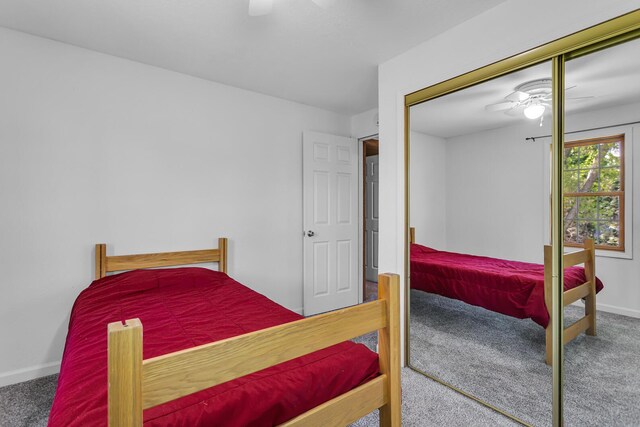8595 Rives Junction Rd, Rives Junction, MI 49277 - bedroom featuring carpet floors, baseboards, a closet, and ceiling fan