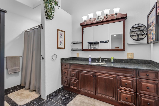 8595 Rives Junction Rd, Rives Junction, MI 49277 - bathroom featuring vanity, a shower with shower curtain, and baseboards