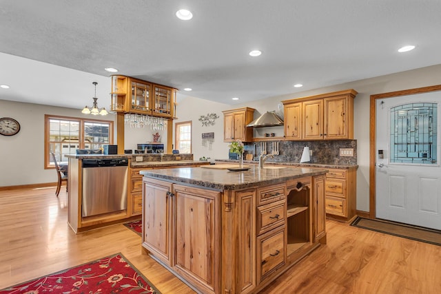 8595 Rives Junction Rd, Rives Junction, MI 49277 - kitchen featuring open shelves, stainless steel dishwasher, light wood-style floors, a center island with sink, and backsplash