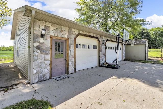 8595 Rives Junction Rd, Rives Junction, MI 49277 - garage featuring driveway