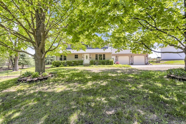 8595 Rives Junction Rd, Rives Junction, MI 49277 - ranch-style house featuring a garage, a front yard, and driveway