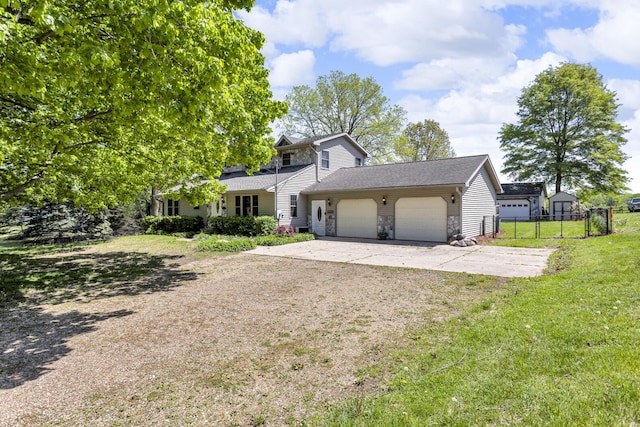 8595 Rives Junction Rd, Rives Junction, MI 49277 - traditional-style home with concrete driveway, a garage, and stone siding
