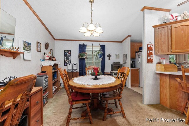 1633 Lavender Dr, Hastings, MI 49058 - dining area featuring light colored carpet, a chandelier, and crown molding