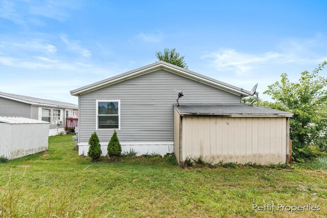 1633 Lavender Dr, Hastings, MI 49058 - view of property exterior with a yard