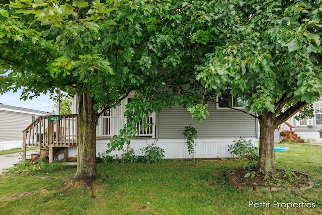 1633 Lavender Dr, Hastings, MI 49058 - view of home's exterior featuring stairs, a lawn, and a deck