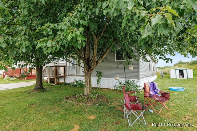 1633 Lavender Dr, Hastings, MI 49058 - view of green lawn featuring a shed and an outdoor structure