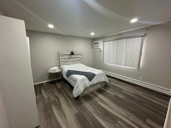 7350 N Inkster Rd Unit 10, Dearborn Heights, MI 48127 - bedroom with recessed lighting, wood finished floors, and a wall mounted AC