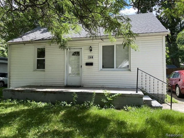 view of front of home with a shingled roof