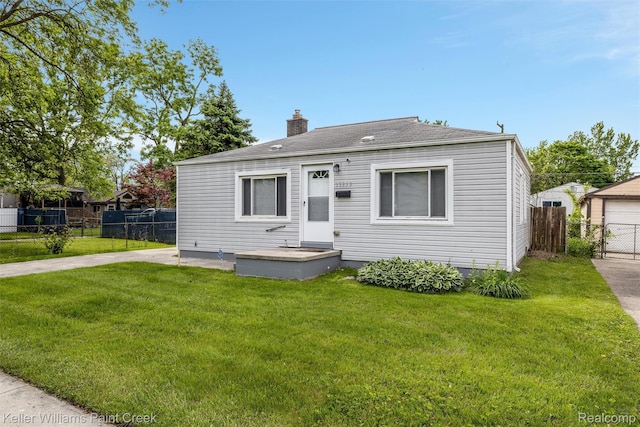 13350 Sidonie Ave, Warren, MI 48089 - view of front of house with a chimney and a shingled roof