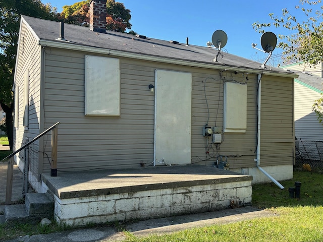 18989 Washtenaw St, Harper Woods, MI 48225 - back of house featuring a chimney