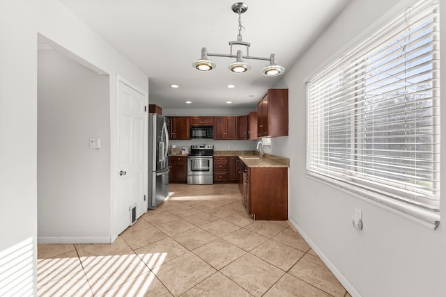 kitchen featuring stainless steel appliances, a sink, light tile patterned floors, recessed lighting, and baseboards