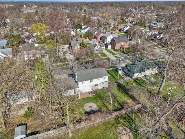 aerial view of property and surrounding area with nearby suburban area