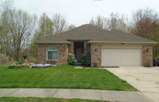 28379 Emerald Ct, Chesterfield, MI 48047 - single story home with an attached garage, concrete driveway, brick siding, a front lawn, and a shingled roof