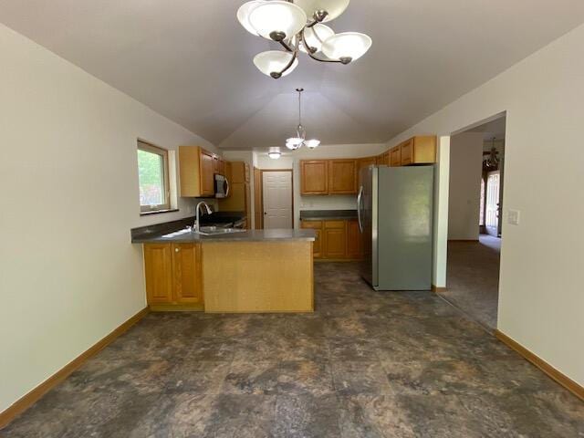 28379 Emerald Ct, Chesterfield, MI 48047 - kitchen with appliances with stainless steel finishes, a chandelier, vaulted ceiling, a peninsula, and dark countertops