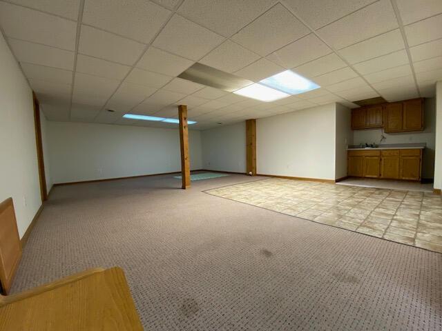 28379 Emerald Ct, Chesterfield, MI 48047 - finished basement with light carpet, baseboards, and a drop ceiling